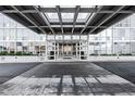 Modern building entrance with covered walkway at 3100 E Cherry Creek South Dr # 903, Denver, CO 80209