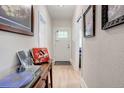 Inviting hallway showcasing light-wood floors and stylish decor at 737 La Farge Ave, Louisville, CO 80027
