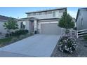 Two-story house with stone accents and landscaped yard at 1886 Makley Loop, Castle Rock, CO 80104