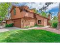 Beautiful exterior showcasing a two-story home with a balcony, lawn, and brick accents at 262 Yank Ct, Lakewood, CO 80228