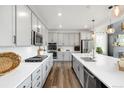 Modern kitchen features stainless steel appliances, gray cabinets, and a spacious island at 800 Meadowlark Dr, Erie, CO 80516