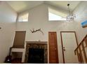 Bright living room with fireplace, high ceilings, and large windows, creating a spacious feel at 6836 W 84Th Cir # 15, Arvada, CO 80003