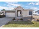 Charming home boasts stone accents, a well-maintained lawn, and a spacious driveway at 2059 June Ct, Castle Rock, CO 80104