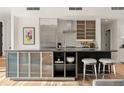 Bright kitchen island with bar seating, sleek countertops, and ample storage, perfect for entertaining at 1644 Little Raven St, Denver, CO 80202