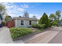 Charming single-story home featuring a landscaped front yard and well-manicured green shrubbery at 1650 Bedivere Cir, Lafayette, CO 80026