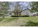 Charming home with mature landscaping and a beautiful lawn at 34544 Columbine W Trl, Elizabeth, CO 80107