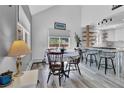 Bright dining area with mountain views, leading into the updated kitchen at 32187 Sylvan Rd, Golden, CO 80403