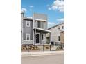 Modern townhouse with neutral color scheme and minimalist landscaping at 4588 S Versailles St # B, Aurora, CO 80015