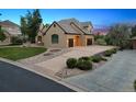 Charming home with a well-manicured lawn, complemented by a long driveway and mature trees at 81 Falcon Hills Dr, Highlands Ranch, CO 80126