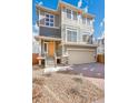 Charming two-story home with a two-car garage and a well-manicured front yard at 10124 Xanadu St, Commerce City, CO 80022