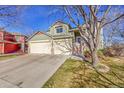 Charming two-story home with a three-car garage, well maintained lawn, and inviting front entrance at 12356 Wolff Dr, Broomfield, CO 80020