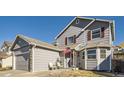 View of the home's exterior, showcasing the siding, roofline, and landscaping at 11042 Blackwolf Ln, Parker, CO 80138