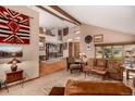 Spacious living room with vaulted ceiling, exposed beams, and natural light at 10227 Osceola Ct, Westminster, CO 80031