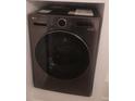 Modern LG washer and dryer combo set in laundry room, ready for convenient in-home cleaning at 7185 S Gaylord St # G13, Littleton, CO 80122