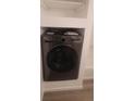 Modern LG washer and dryer combo set in laundry room, ready for convenient in-home cleaning at 7185 S Gaylord St # G13, Littleton, CO 80122