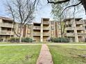 Apartment building with balconies, a pathway and green space at 1302 S Parker Rd # 316, Denver, CO 80231