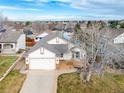 Housetop view of a house with a yard and solar panels at 9488 Brook Ln, Lone Tree, CO 80124