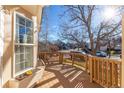 Wooden deck overlooking a residential street at 9488 Brook Ln, Lone Tree, CO 80124