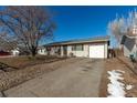 Charming single-story home featuring a gravel front yard, concrete driveway and attached one car garage at 1331 4Th St, Fort Lupton, CO 80621