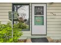Close-up of front door with sidelight, mail box, and clear numbering at 7948 Stuart St, Westminster, CO 80030