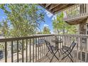 Relaxing balcony area with seating offers a quiet outdoor space to enjoy the fresh air at 381 S Ames St # F208, Lakewood, CO 80226