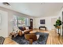 Stylish living room with hardwood floors, modern furniture, and neutral decor at 900 Locust St, Denver, CO 80220