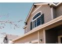 Close-up of home exterior showcasing architectural details and window design at 2741 Sunset Way, Erie, CO 80516