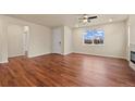 Spacious living room features hardwood floors, lots of windows, and an open layout at 152 Ambrose St, Erie, CO 80516