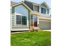 Close up front exterior of home with attractive green lawn at 20389 E Powers Pl, Centennial, CO 80015