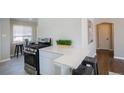 Modern kitchen with stainless steel appliances, sleek countertops, and barstool seating at 500 S Pennsylvania St # 520, Denver, CO 80209