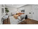 Inviting living room boasts hardwood floors, stylish furniture, and ample natural light with an open layout at 500 S Pennsylvania St # 520, Denver, CO 80209
