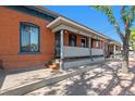 Charming brick home with a covered porch at 561 Cherokee St, Denver, CO 80204