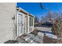 House entrance with security door and small stoop at 11914 Bellaire Cir, Thornton, CO 80233