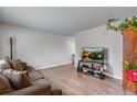Modern living room design with a comfortable seating area, ideal for relaxation and social gatherings at 15628 E Girard Pl, Aurora, CO 80013