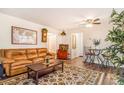 Inviting living room with a comfortable leather sofa and stylish decor at 12655 E Pacific Cir # E, Aurora, CO 80014