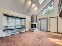 Living room with a fireplace and large bay window at 1076 S Leyden St, Denver, CO 80224