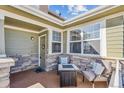 Cozy porch with seating area, stone accents, and natural light, creating an inviting entry at 3713 S Perth Cir # 104, Aurora, CO 80013