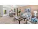 Bright living room and dining area with modern decor and a view of the outdoors at 10152 Telluride St, Littleton, CO 80125