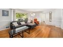 Bright living room with a large window, hardwood floors, and comfortable seating at 3900 Garland St, Wheat Ridge, CO 80033