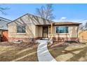 Charming home featuring brick accents and a welcoming entrance with a concrete walkway at 4499 E Colorado Ave, Denver, CO 80222