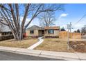 Traditional ranch-style home with large front yard and walkway leading to the front door at 4499 E Colorado Ave, Denver, CO 80222