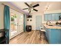 Kitchen-adjacent space boasting backyard access and updated appliances at 12234 W Saratoga Ave, Morrison, CO 80465