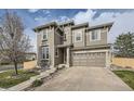 Charming two-story home features a stone-accented facade and attached two-car garage at 5572 Fullerton Cir, Highlands Ranch, CO 80130