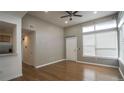 Bright, open living room with hardwood floors and a ceiling fan at 2829 Syracuse Ct # 237, Denver, CO 80238