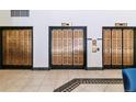 Close-up of elevator doors with classic design and marble surrounds at 444 17Th St # 1003, Denver, CO 80202