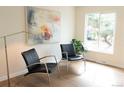 Inviting living room featuring modern chairs, natural light, and stylish decor at 3073 W Center Ave # C, Denver, CO 80219