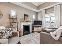 Cozy living room with a fireplace, comfortable seating, natural light, and stylish decor, perfect for relaxing at 1194 S Washington St, Denver, CO 80210
