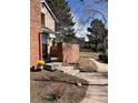 Brick accent wall and stone steps at the front entrance of this charming townhome at 11886 Elk Head Range Rd, Littleton, CO 80127