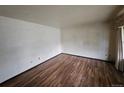 Spacious living room with hardwood flooring, offering a versatile and inviting space at 912 E 6Th Ave, Broomfield, CO 80020