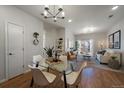 Bright and airy living room and dining area with modern furnishings and hardwood floors at 1841 S Dunkirk St # 203, Aurora, CO 80017